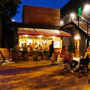 people sitting outside at night