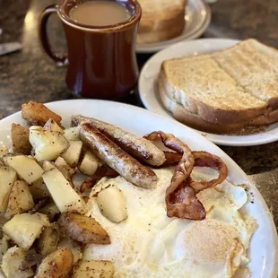 Three Eggs, 2 bacon, 2 sausage, country potatoes, sourdough toast and coffee.