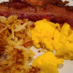 Eggs, bacon  hand ashbrowns.