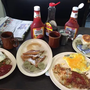 three plates of breakfast food