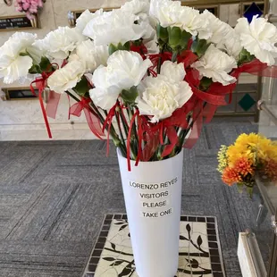 Because of Covid, Services limited to immediate family only we set up carnations for all visitors to take one that couldn't attend.