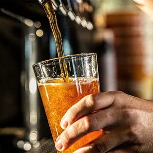 a beer being poured into a glass