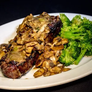 NY strip steak smothered in freshly sautéed mushrooms