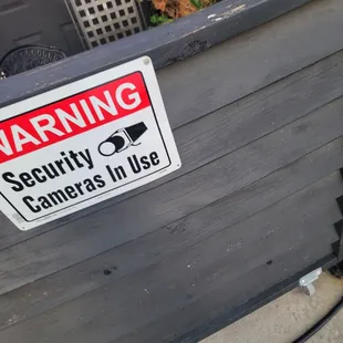 Signs around the building that are put up as a deterrent. There is no actual security cameras