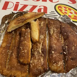 Breadsticks that clearly aren't fresh and hard to the touch.