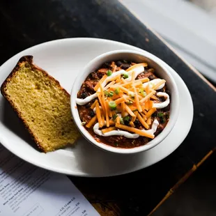 a bowl of chili and bread
