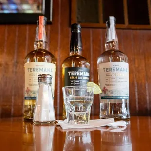 three bottles of whiskey on a table