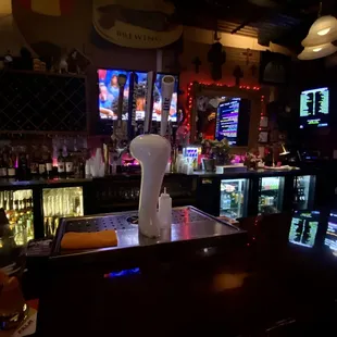 a bar with a beer on the counter