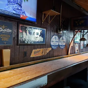 a bar with a long wooden table