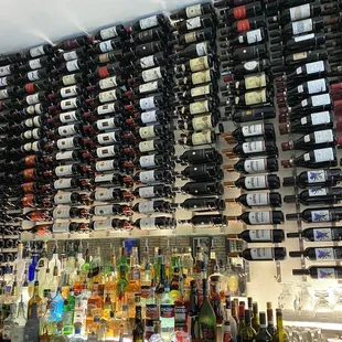 a wall full of wine bottles