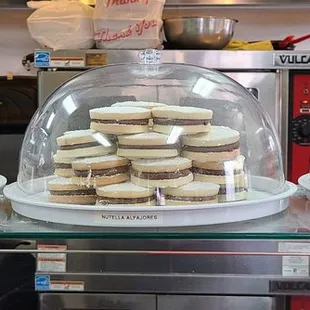 stacks of cookies in a glass dome