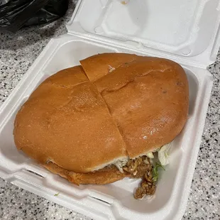 a sandwich in a styrofoam container