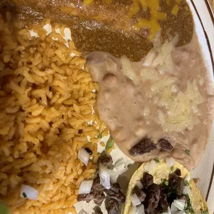 Cheese Enchilada, Taco De Asada, Beans, and Rice.