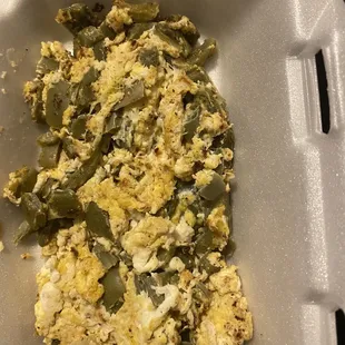 a close up of a meal in a styrofoam container