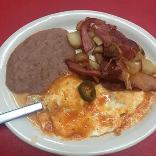 Huevos Rancheros with bacon ...hot and fresh.
