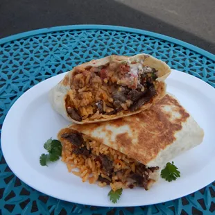 Huge Burritos filled with choice of meat, beans, rice, cheese, sour cream, and fresh salsa.