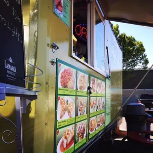 Squished between KFC &amp; Papa Murphys, parking, other carts &amp; seating