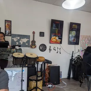 a man sitting at a table in a music studio