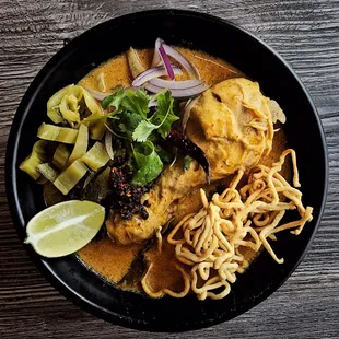 "Kao Soi"  northern style chicken with curry. Perfect blend of tasty curry and juicy chicken. What are you waiting for? Give us a call.