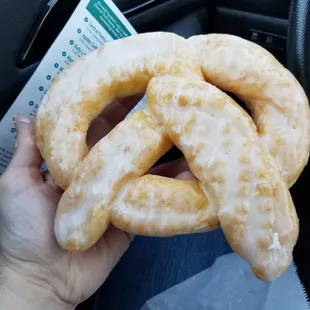One huge glazed donut, pretzel shaped