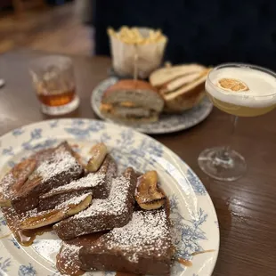 a plate of french toast and a drink