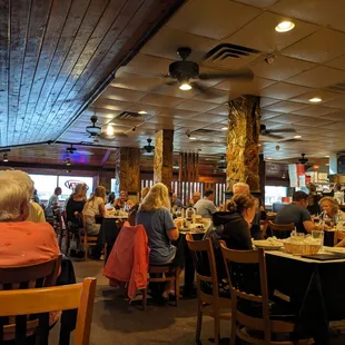 a large group of people sitting at tables