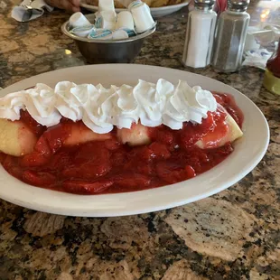 Cheese Blintzes. Crepe filled with strawberries and whipped cream.