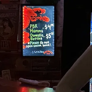 a neon sign in a bar