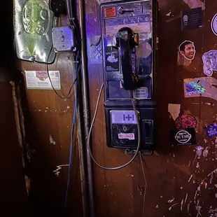 an old payphone in a basement