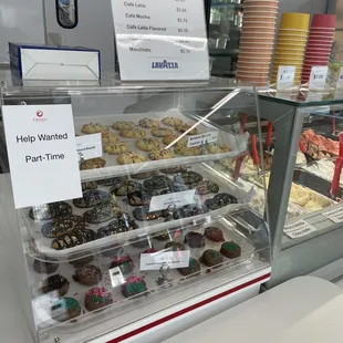 Tray of goodies available for purchase and coffee menu.