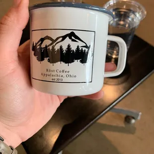 a person holding a coffee mug