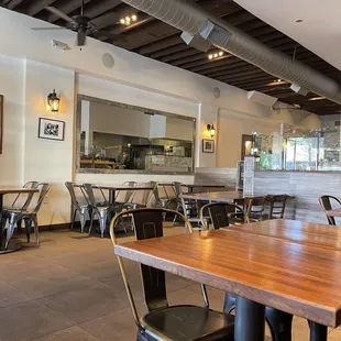 a restaurant with tables and chairs