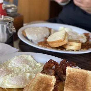 two plates of breakfast food
