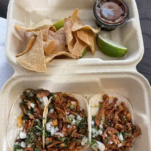 Extra Bag of Chips and Al Pastor Tacos the chips are insanely good and very authentic