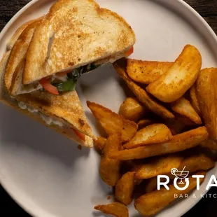 a plate with a sandwich and french fries