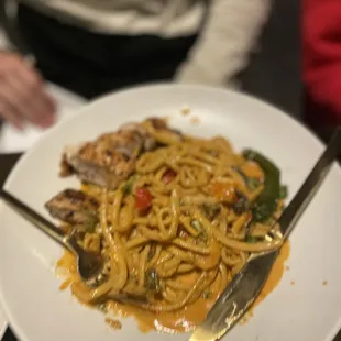 a plate of pasta with a fork