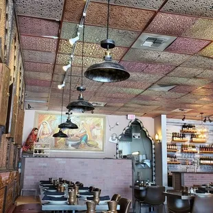 a dining area with tables and chairs