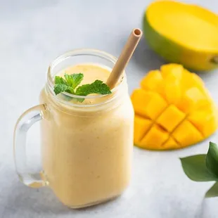 a mango smoothie in a mason jar