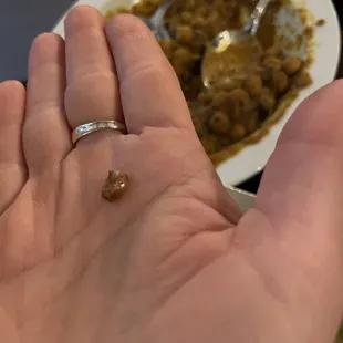 A solid rock in our Chana masala that my bf bit into and chipped his tooth on