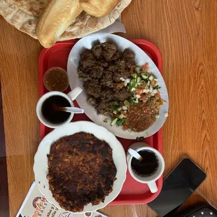 a plate of food on a red tray