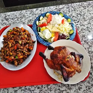 two plates of food on a red tray