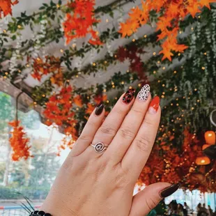 a woman&apos;s hand with a ring on it