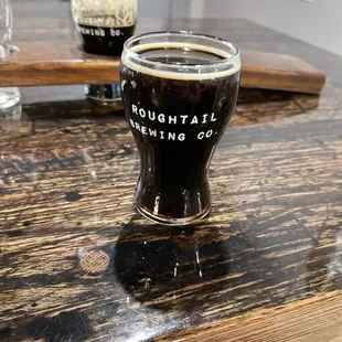 a pint of beer on a table