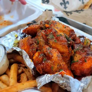 Lemon pepper infused Buffalo sauce wings