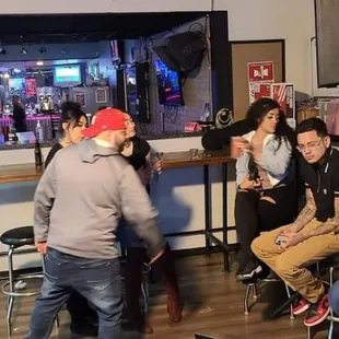 a group of people sitting and standing