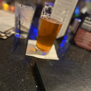 a pint of beer on the bar