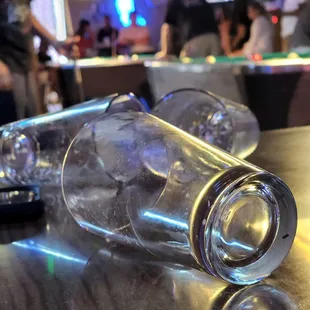 two empty glasses on a bar counter