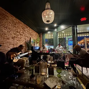 a group of people sitting at a bar