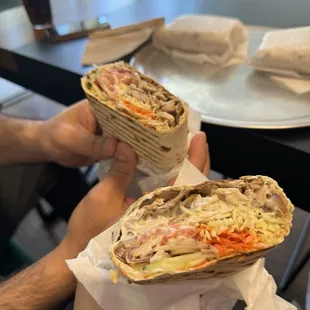 Chicken shawarma wrap made with fresh dough and sauce.
