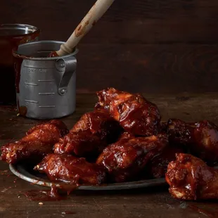 barbecued chicken wings on a plate